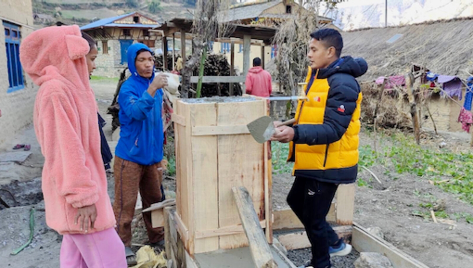 Engineers show local people how to construct a tap in a remote community in Nepal
